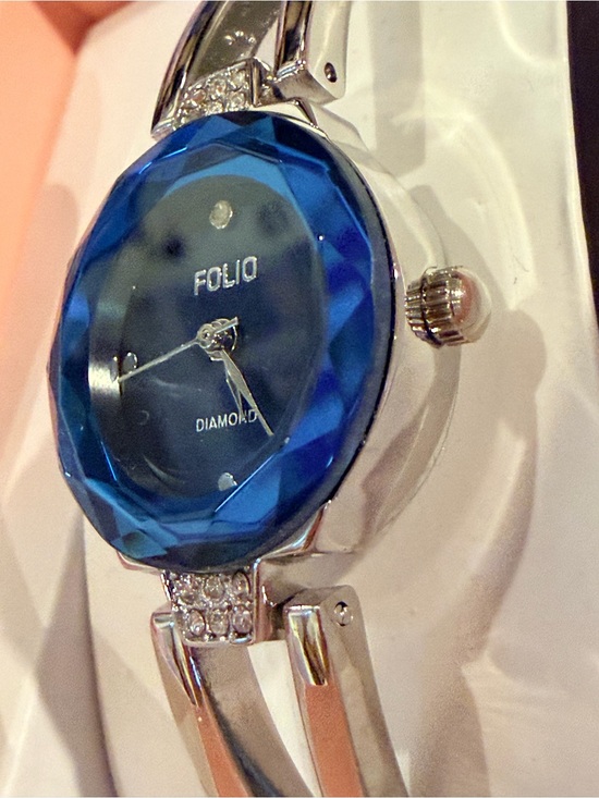 Folio diamond watch with  a blue faceted dial and a silver-tone bangle bracelet main image 5